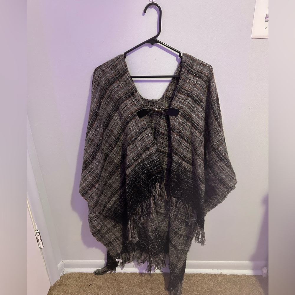 knitted gray/black poncho with brown accents and easy metal clasp